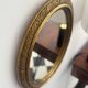Oval gold mirror in Napoléon III style