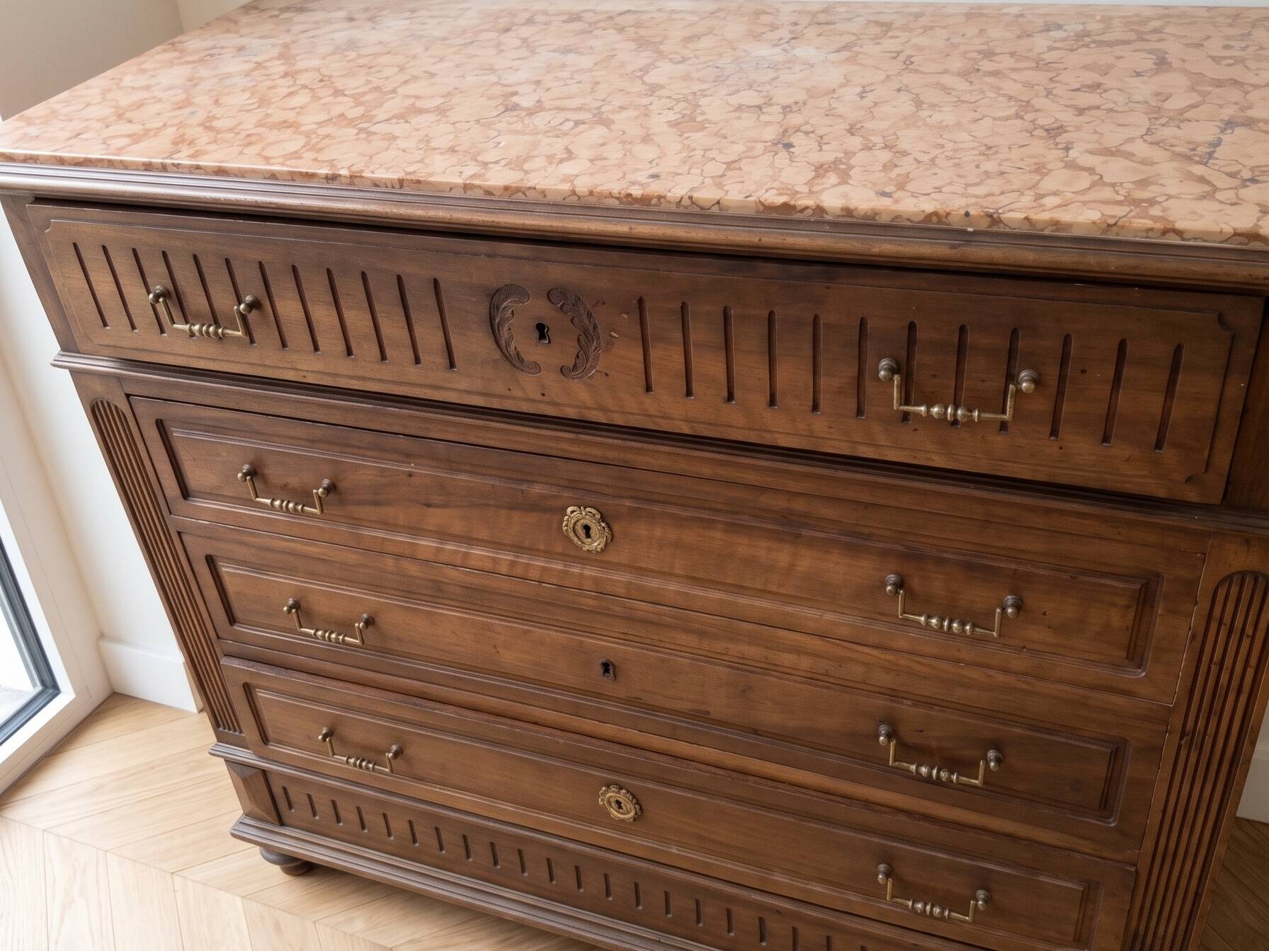 Antique wooden commode with marble top and mirror.