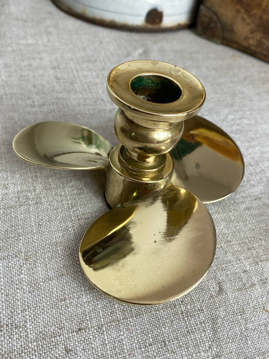 Pair of vintage brass propeller-shaped candlesticks
