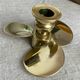 Pair of vintage brass propeller-shaped candlesticks