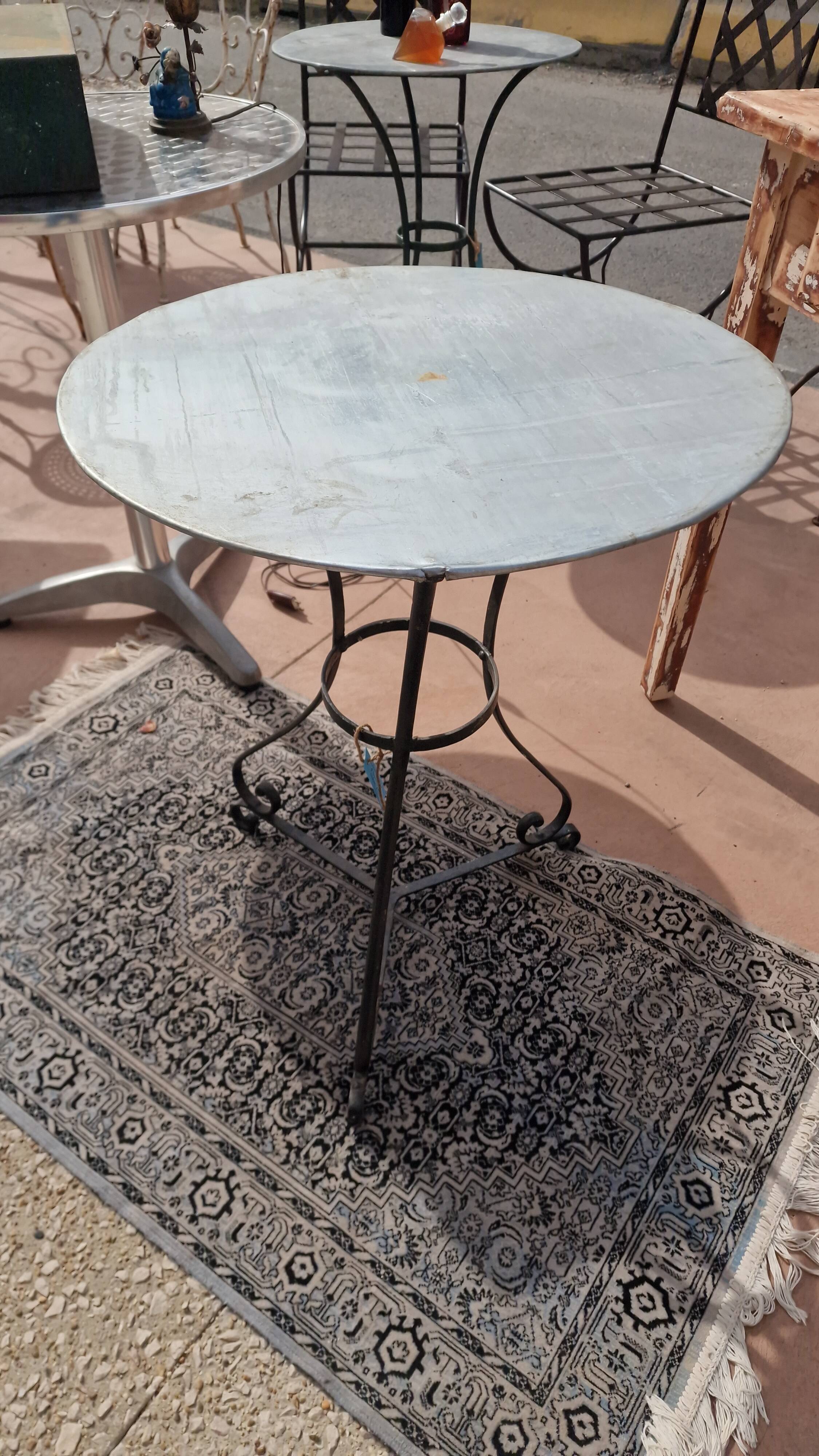 Round wrought iron and zinc bistro table