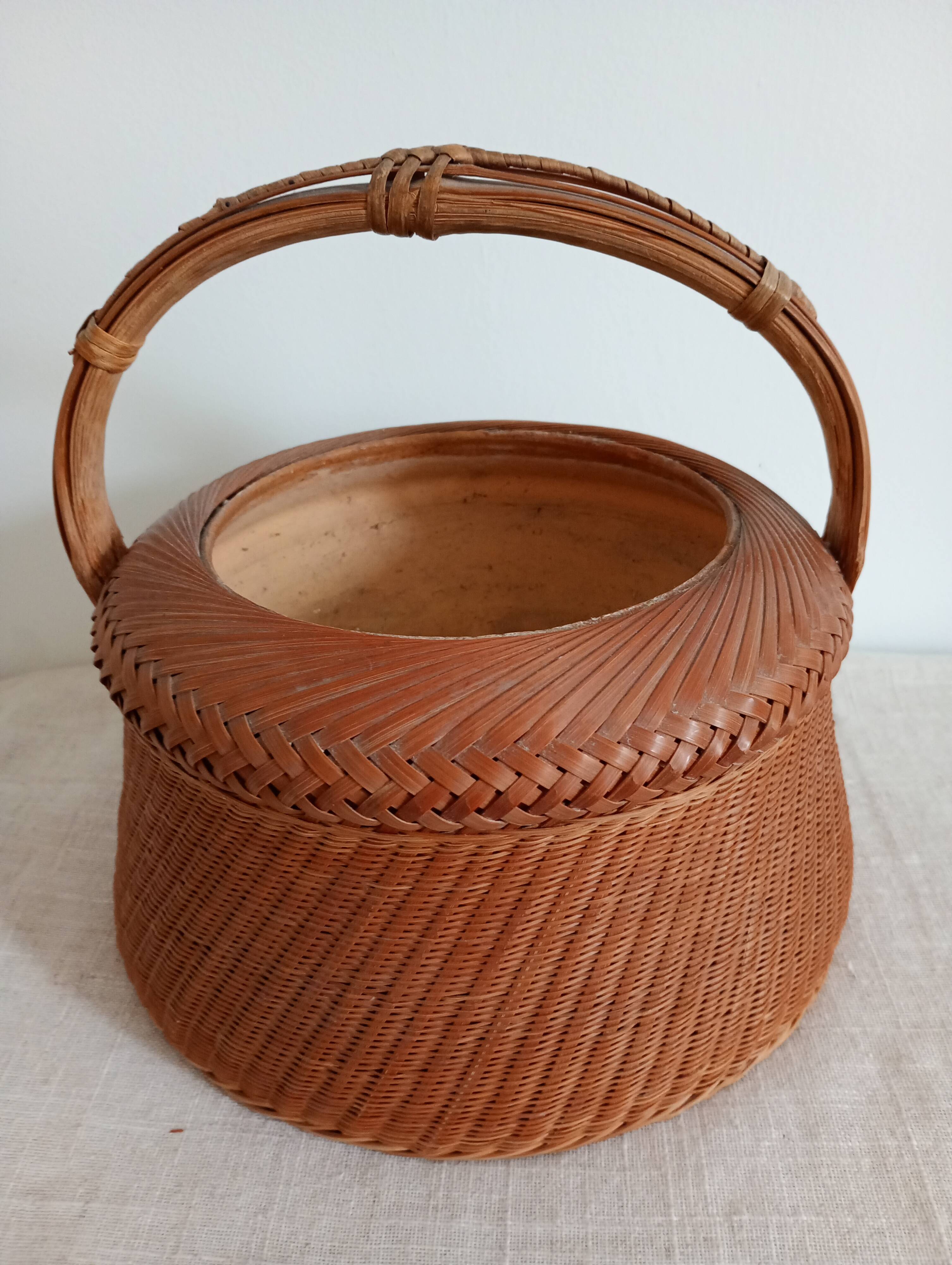 Woven bamboo basket and ceramic. Philippines.