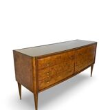 Veneered burl walnut chest of drawers with light warm brown glass top