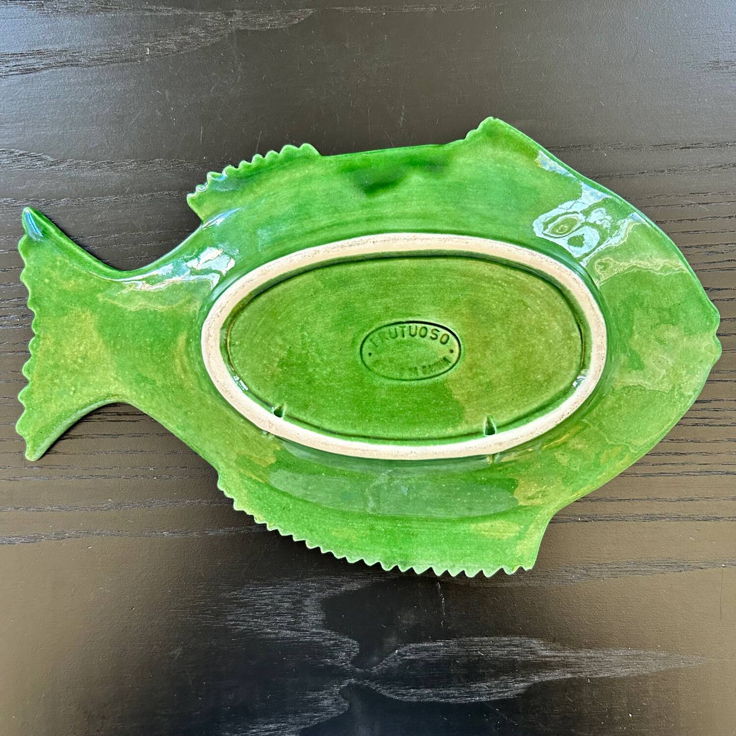Fish dish in green earthenware