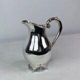 Water jug on feet decorated with ebony of hallmarked silver from the 1940s. The jug is in great anti