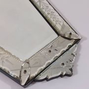 Venetian wall mirror in Murano glass with faceted floral decoration from the 1930s.