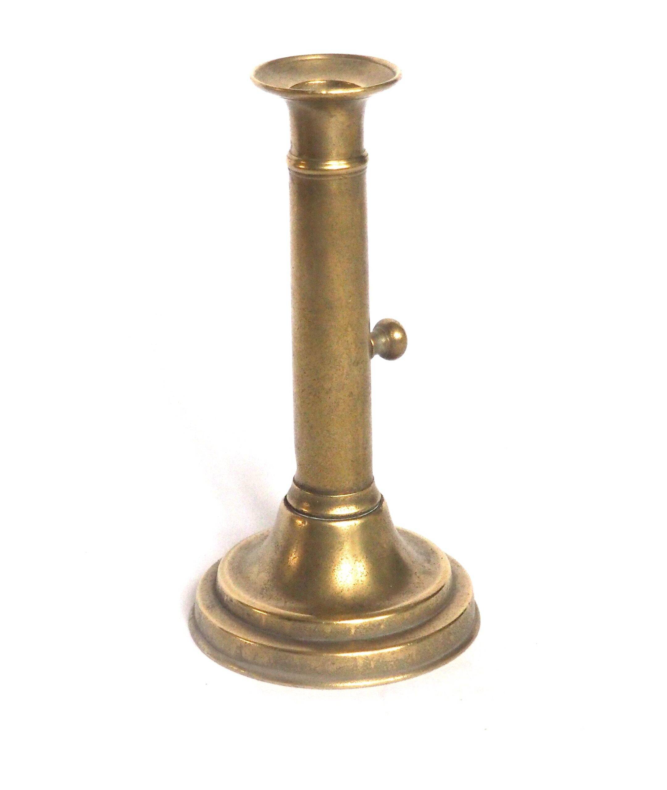 Brass candlestick with a column and bobeche.