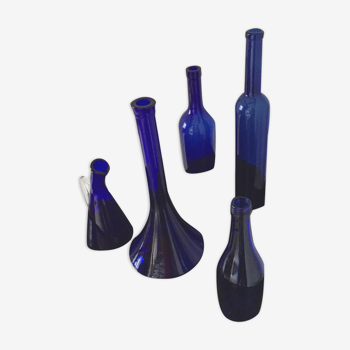 Series of five bottles / jars of cobalt blue apothecary