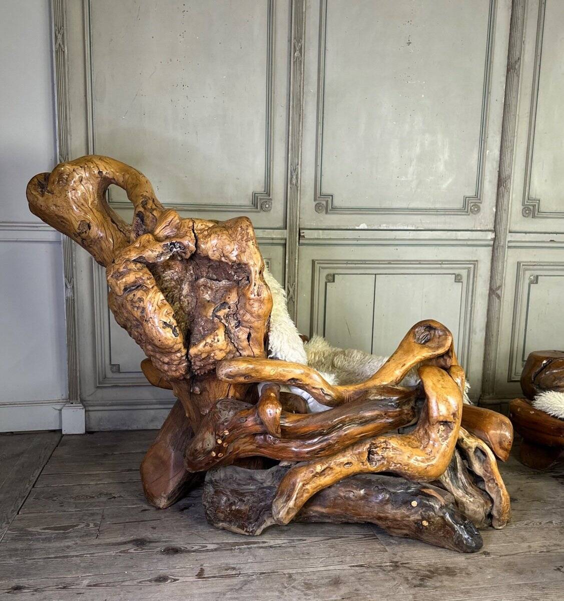 Pair of armchairs and a footstool made of root wood, circa 1970