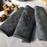 Suite of four napkins tinted in smoke grey