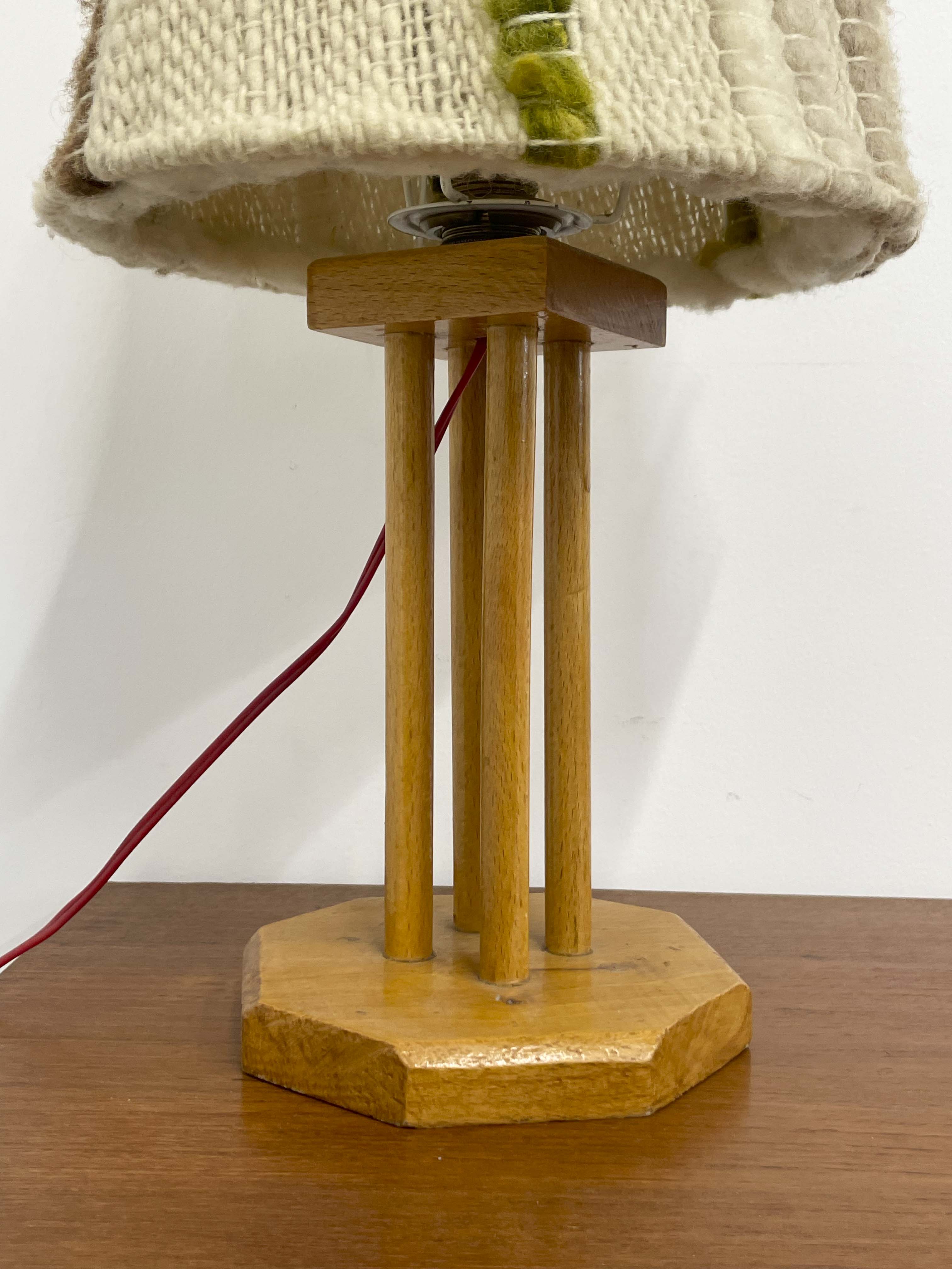 Wooden lamp with a wool shade