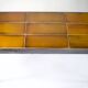 Table basse signée Roger Capron, acier et céramique, motif oiseau