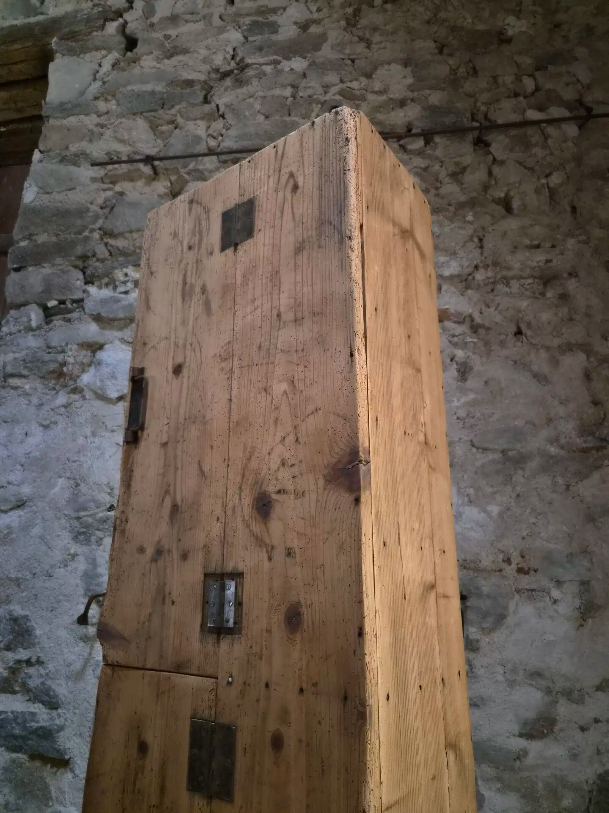 Antique French workshop cabinet in pine with compartments.
