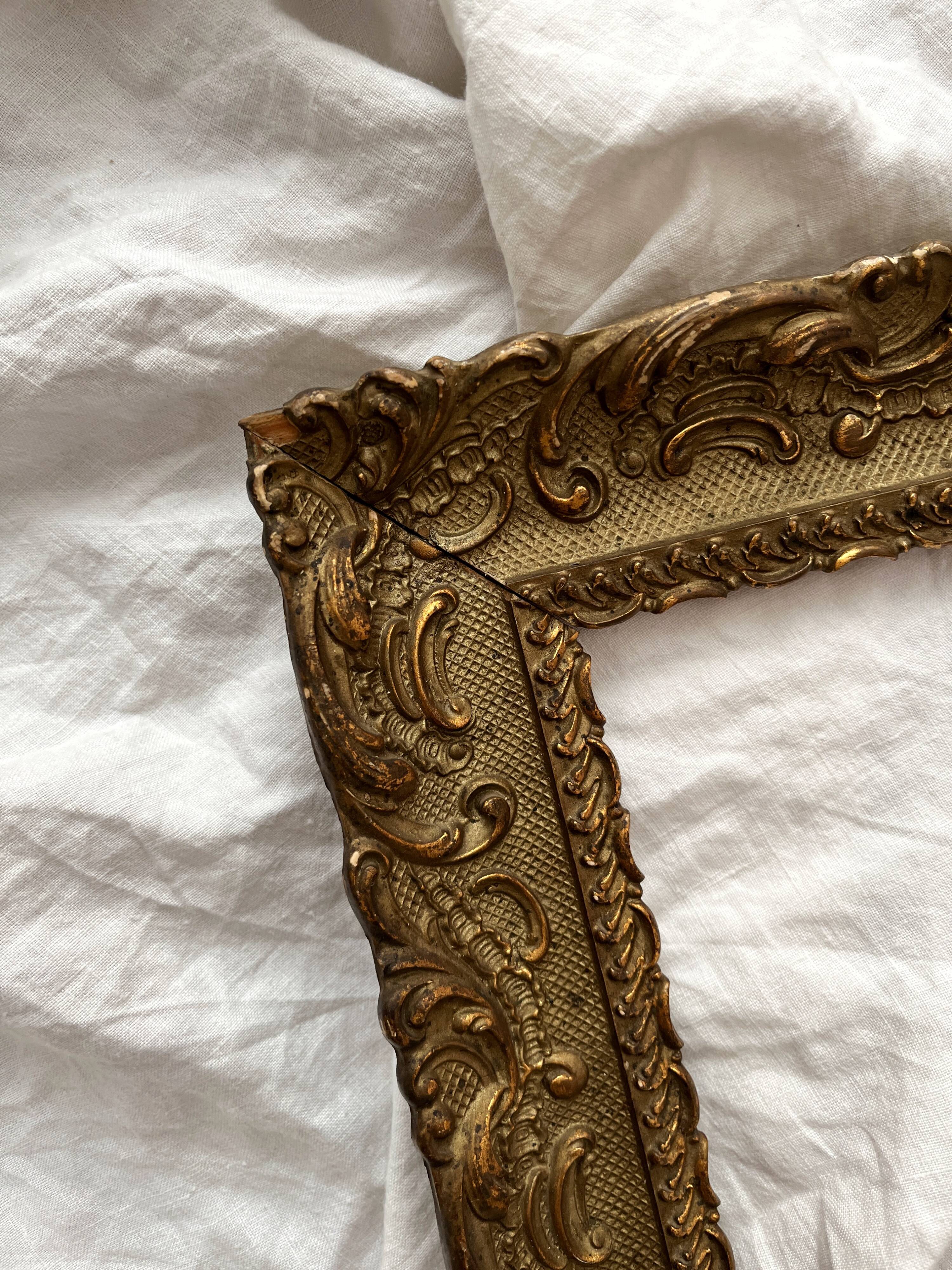 Old frame in gilded wood with stucco decoration circa 1900
