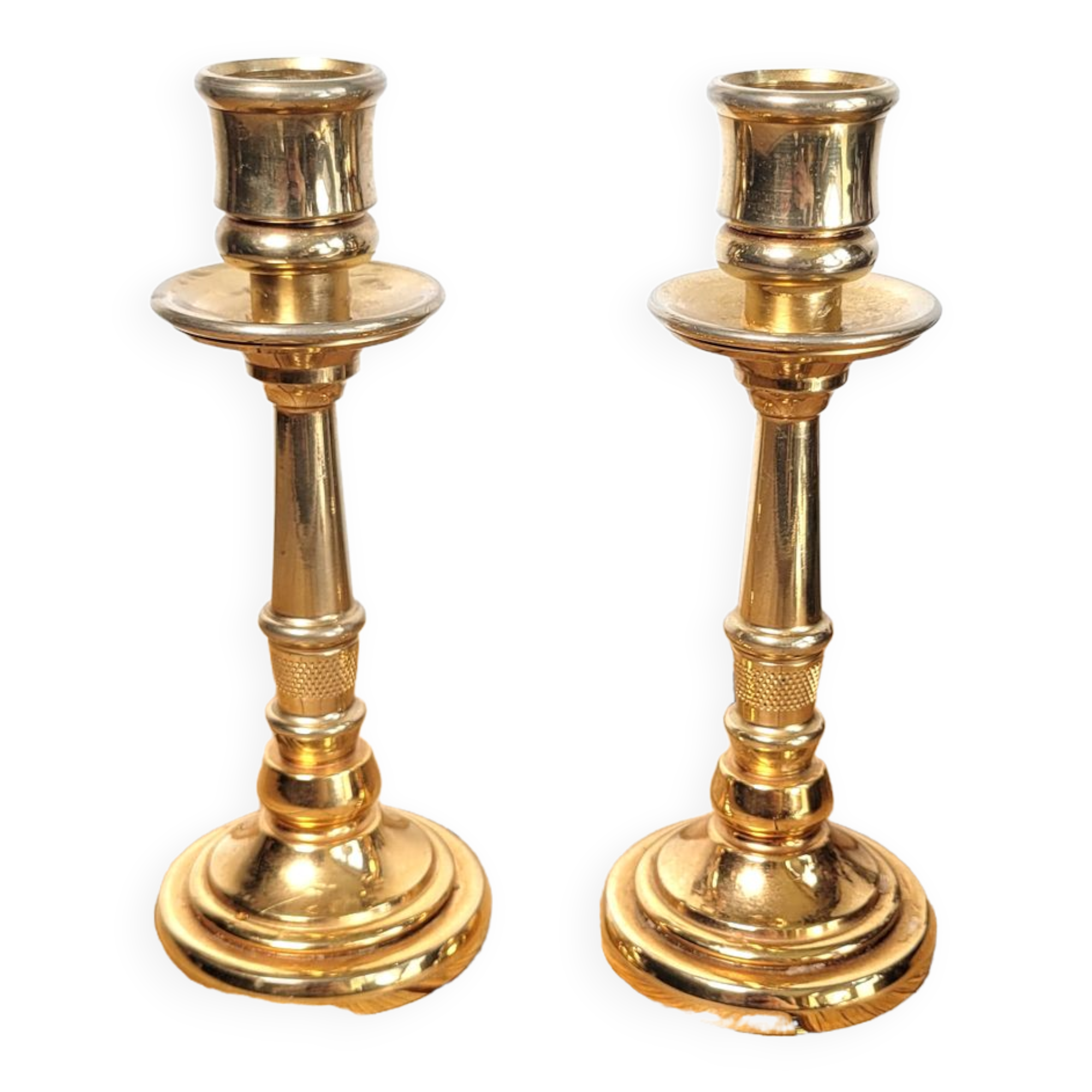Pair of candle holders in solid gilded metal