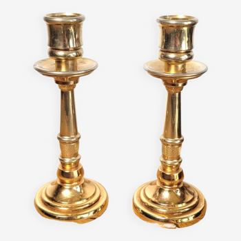 Pair of candle holders in solid gilded metal