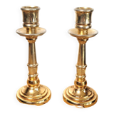 Pair of candle holders in solid gilded metal