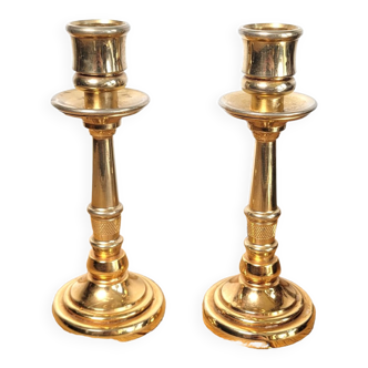 Pair of candle holders in solid gilded metal