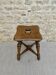 Tabouret en bois massif et sculpté