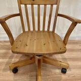 Solid wood swivel and reclining armchair.