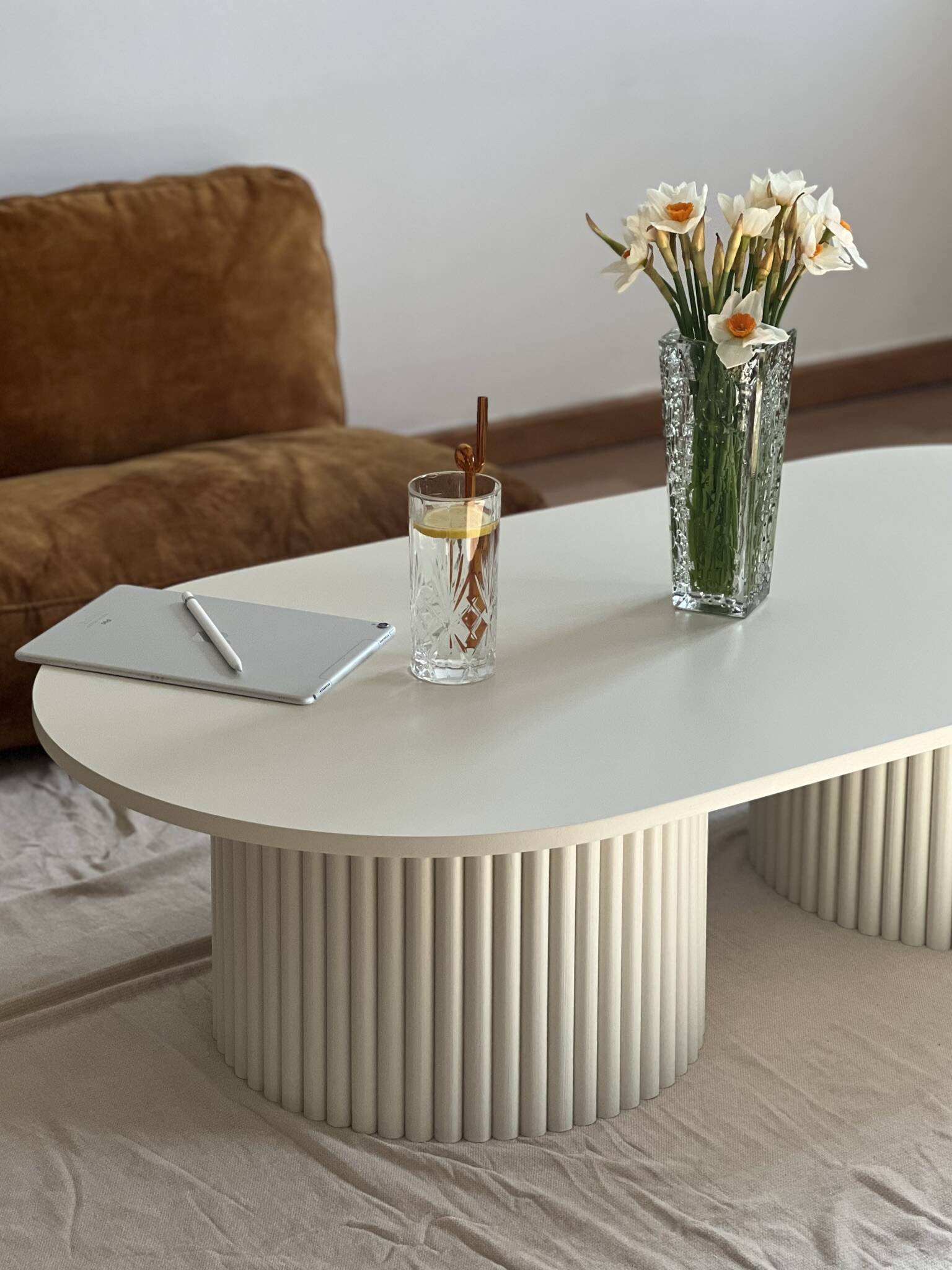 oblong coffee table on 2 fluted bases in light beige