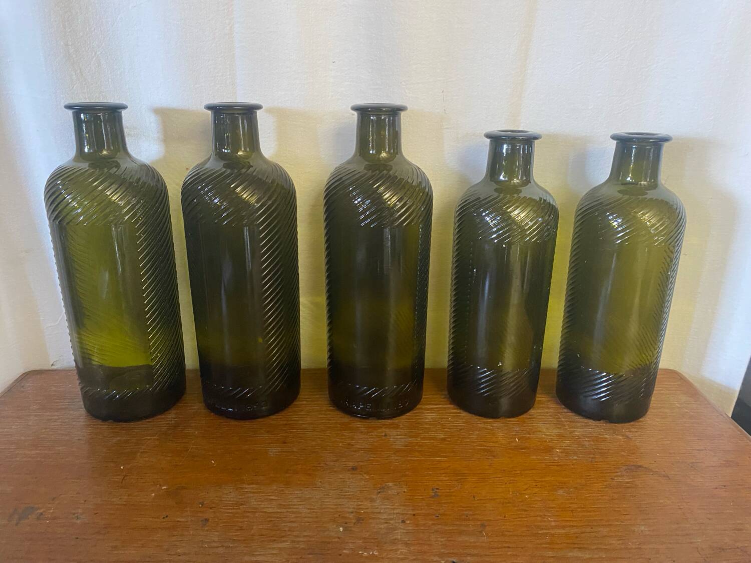 Set of 5 antique carapelli bottles, smoked and ribbed vintage glass