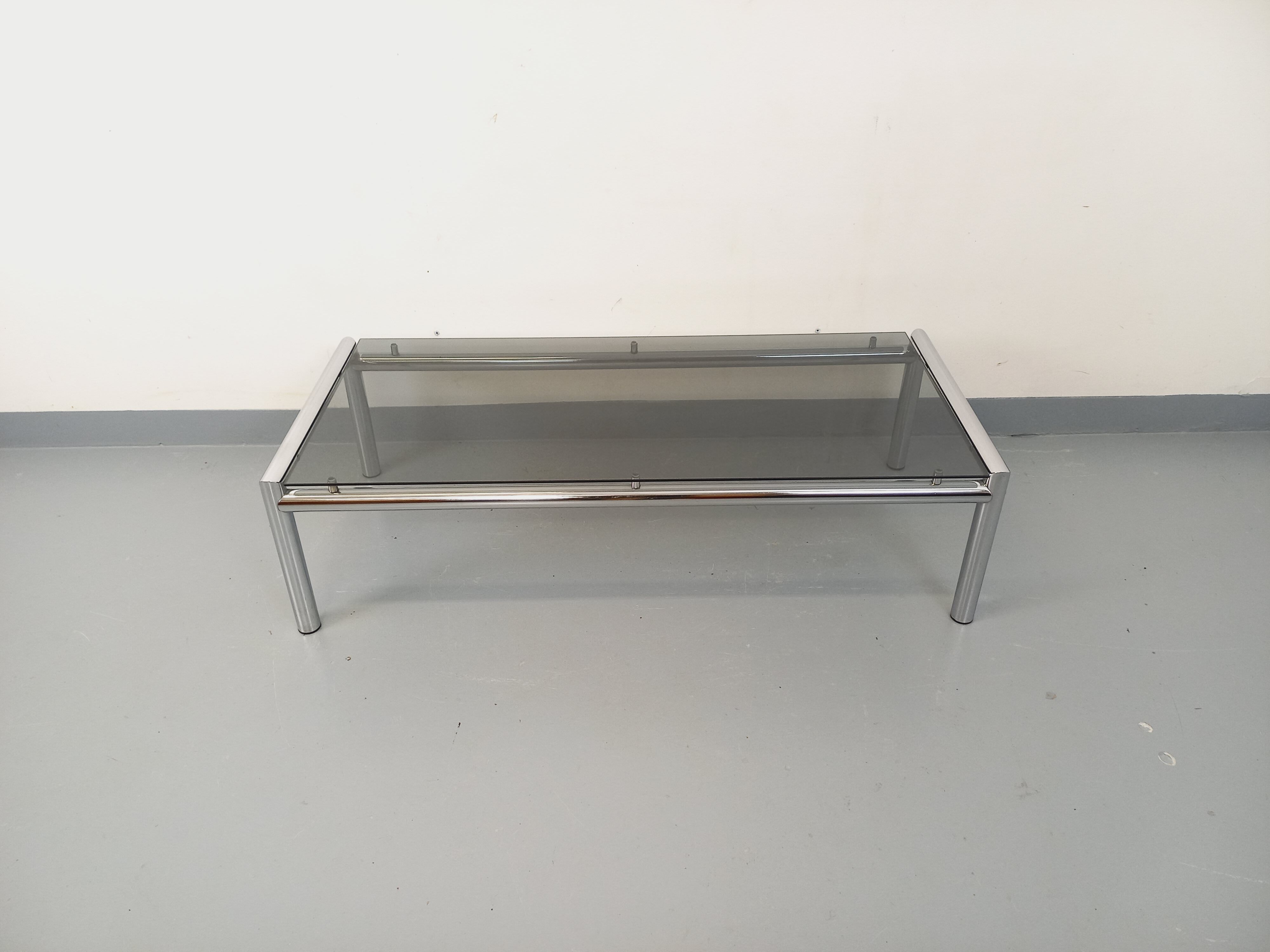 Vintage rectangular coffee table in smoked glass and chrome metal from the 1960s.