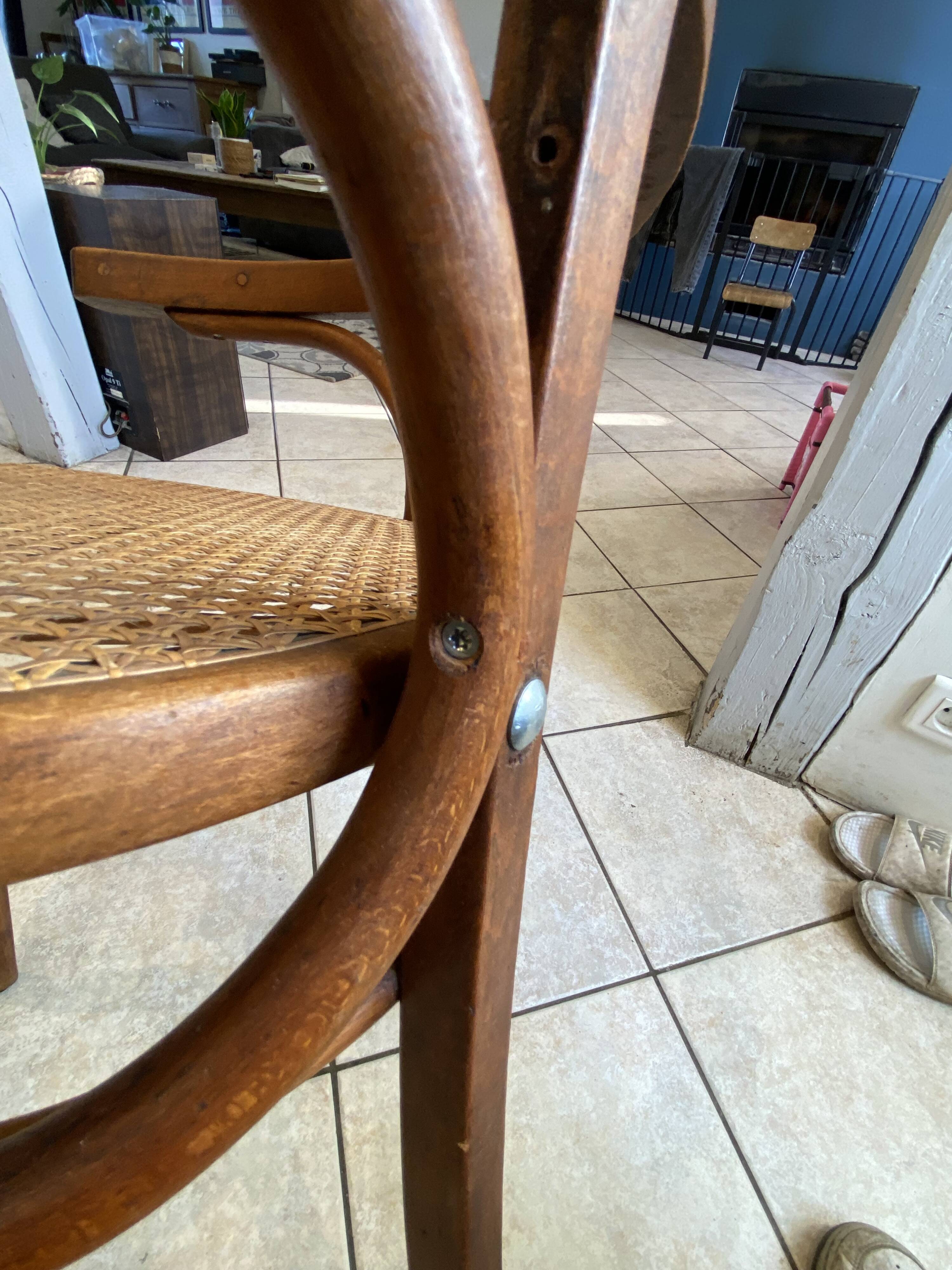 Bistro chair with a curved wooden frame and caned seat from the 1930s.