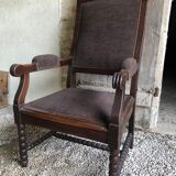 Armchair trimmed with brown fabric
