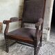 Armchair trimmed with brown fabric