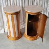 A pair of distressed bedside tables.
