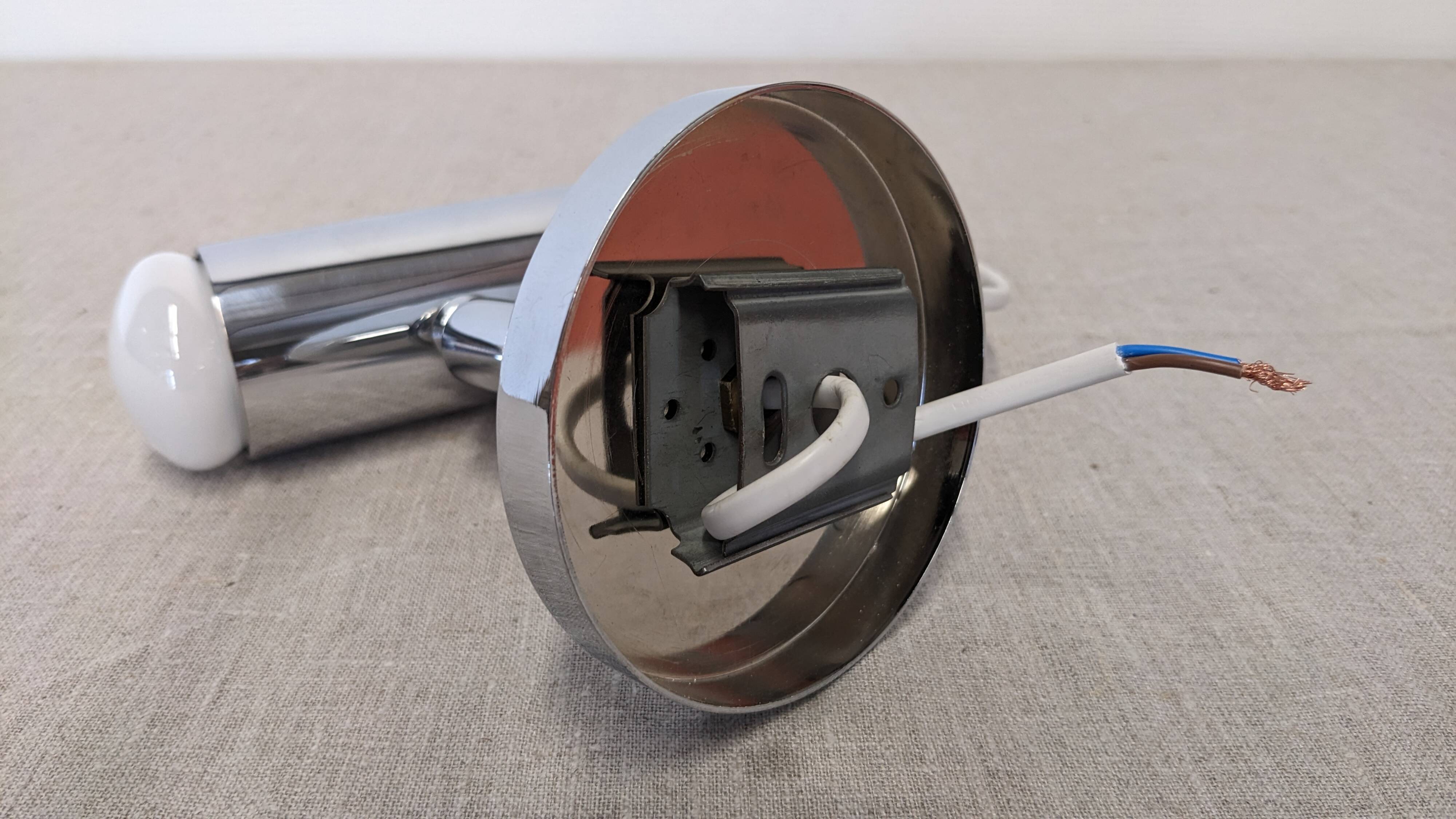 Modernist chrome metal wall light, France circa 1970.