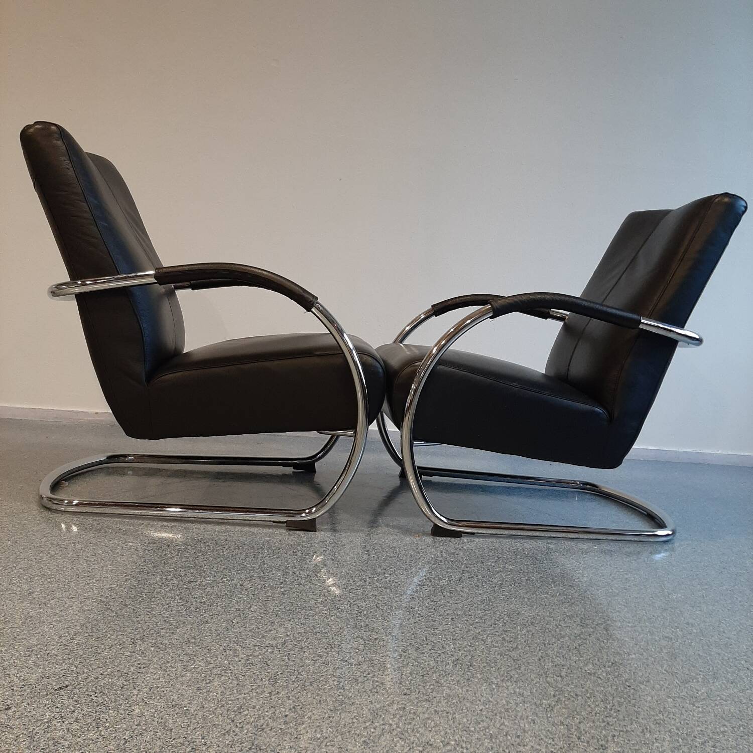 Pair of tubular armchairs