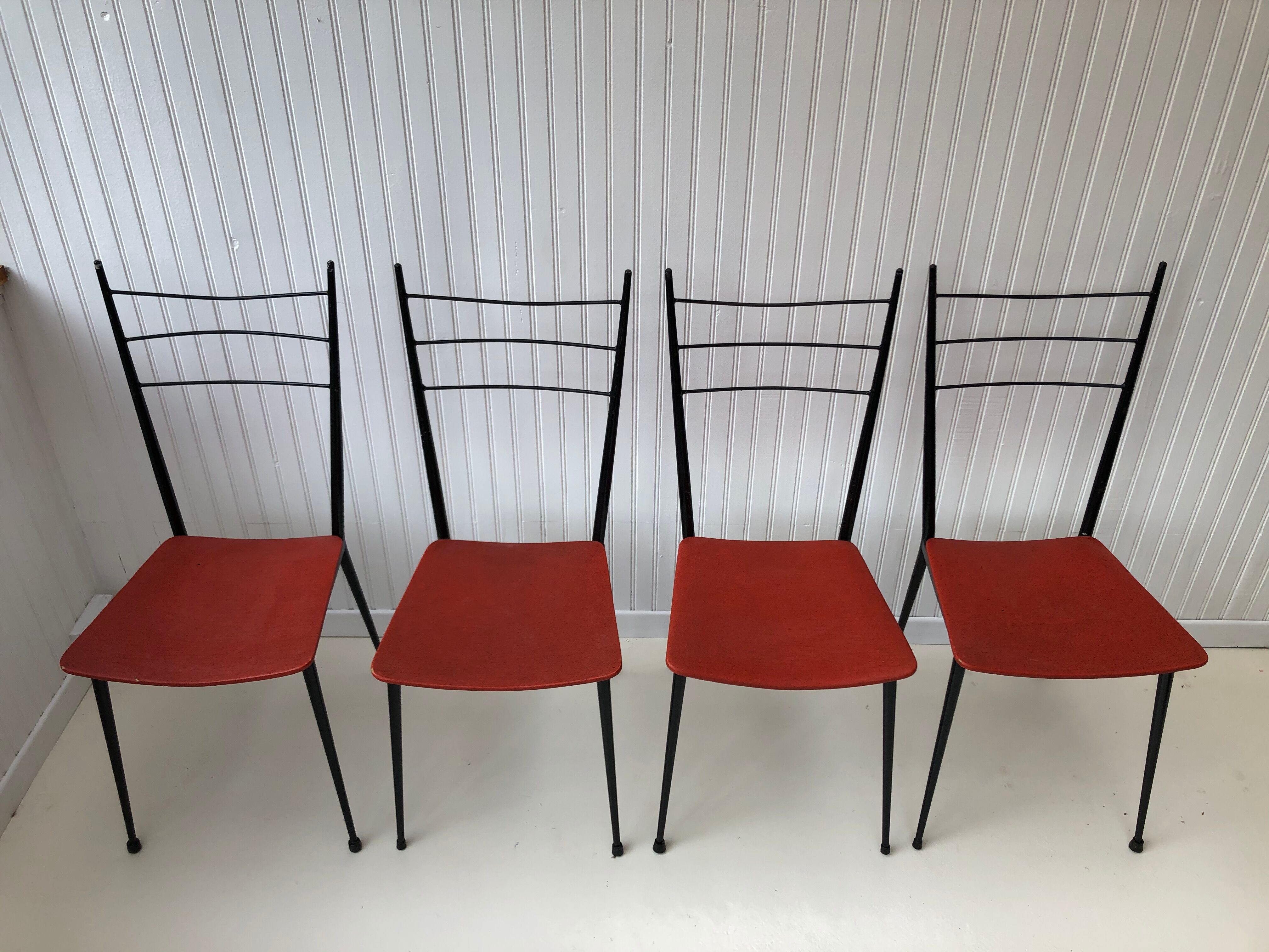 Red metal chairs from the 60s