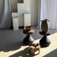 Small low circular four-legged stool in organic old teak with cut-out design H2