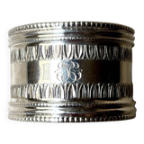 Monogrammed silver napkin ring with palmette and beaded motifs