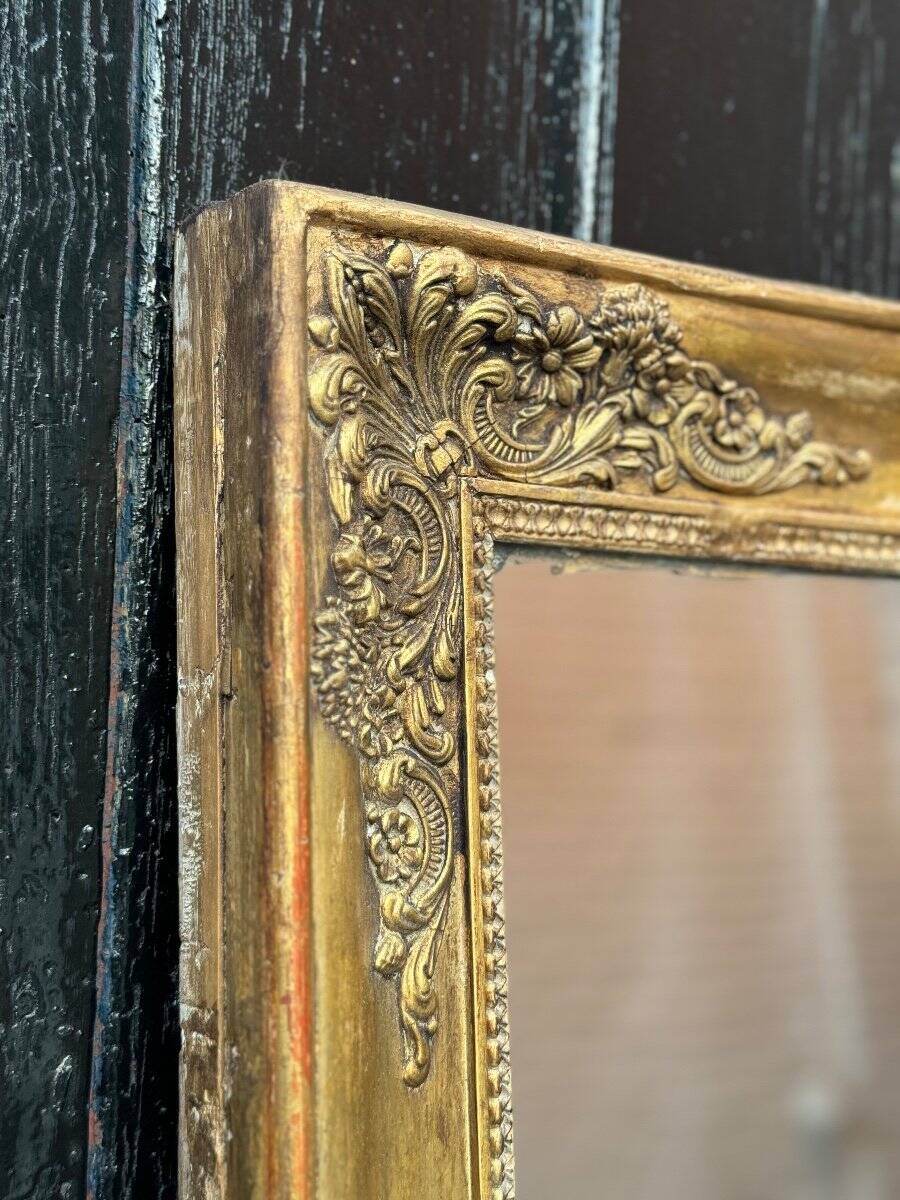Miroir Empire en bois stuqué et doré, début XIXème siècle