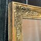 Miroir Empire en bois stuqué et doré, début XIXème siècle