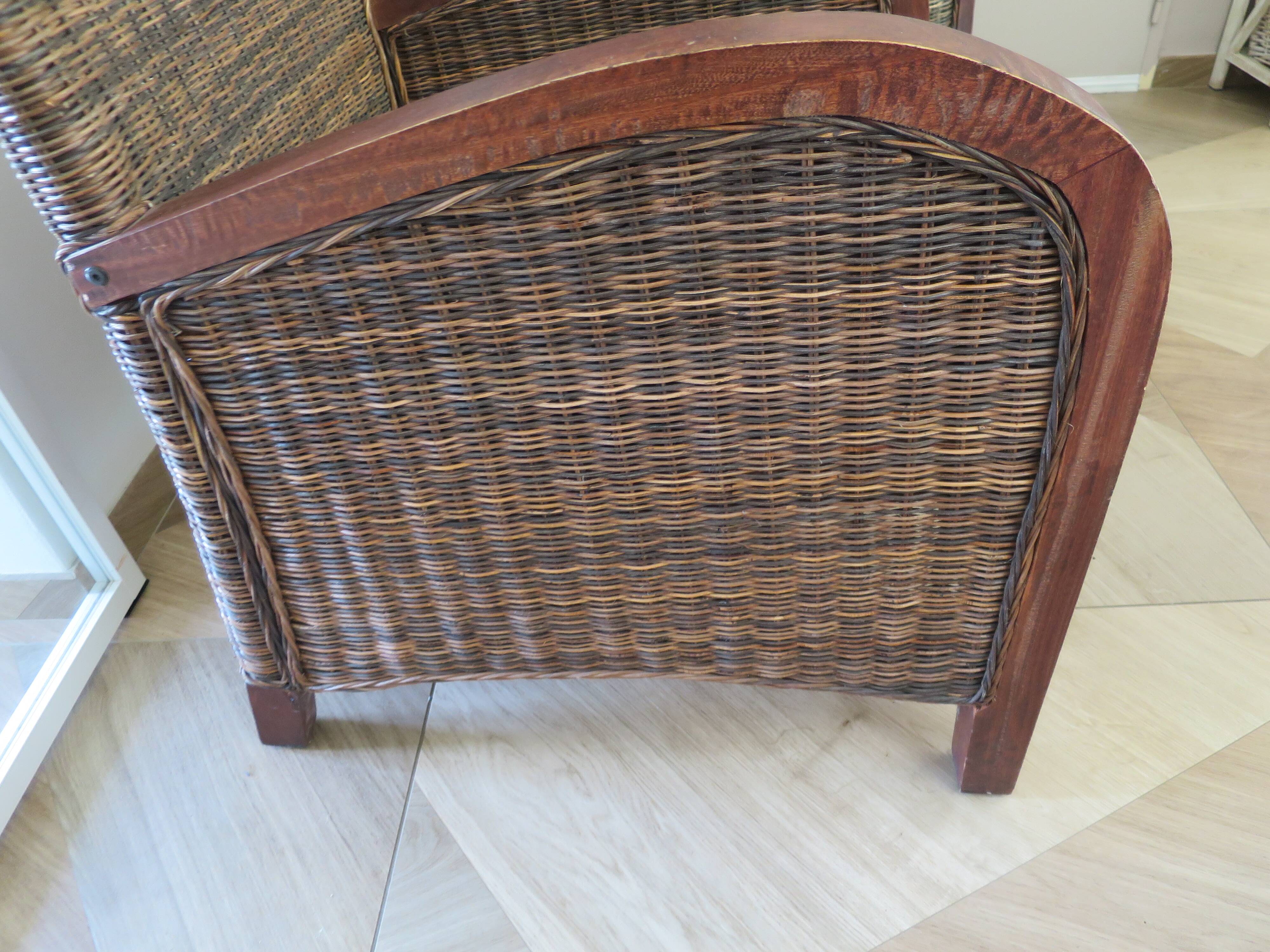 2 colonial-style armchairs in woven rattan and exotic wood