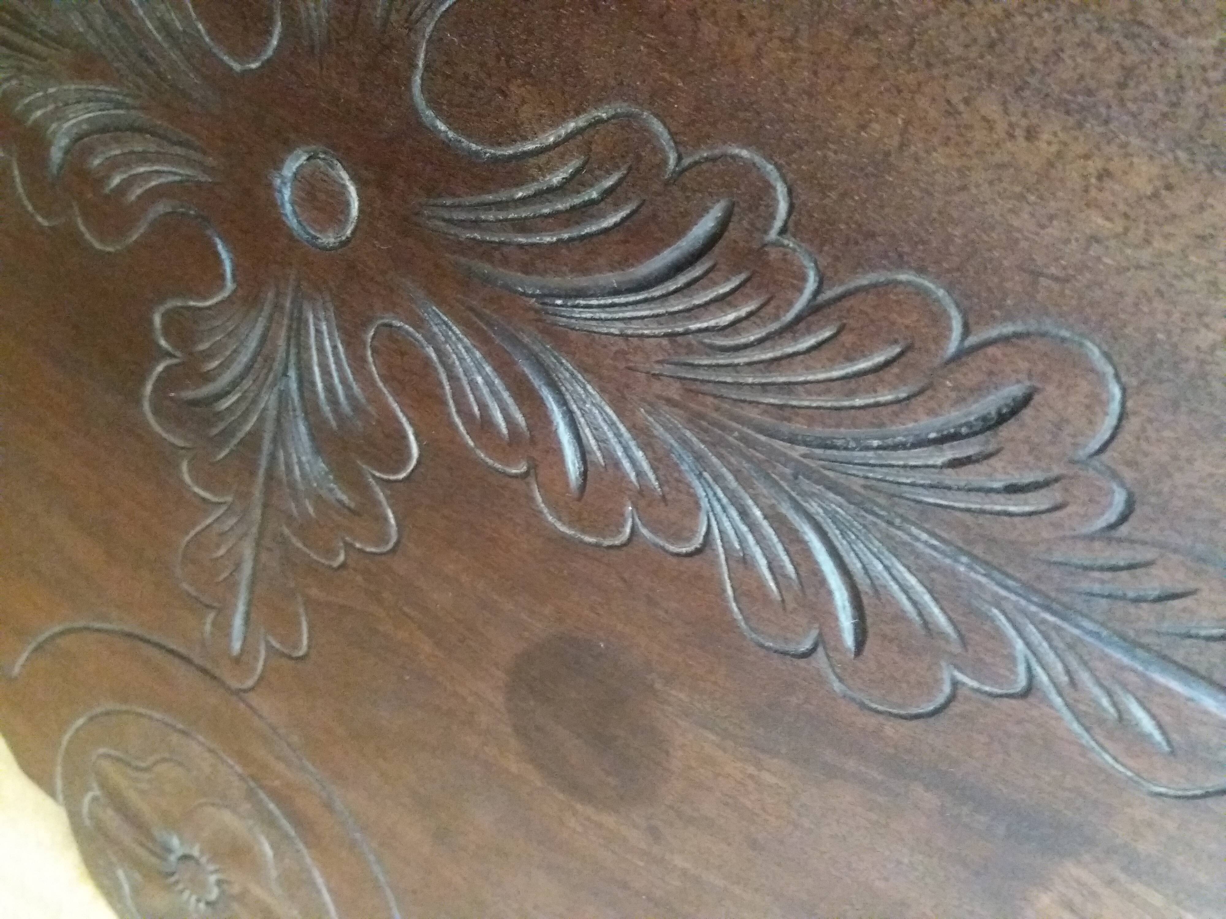 Triplet console harness in carved wood