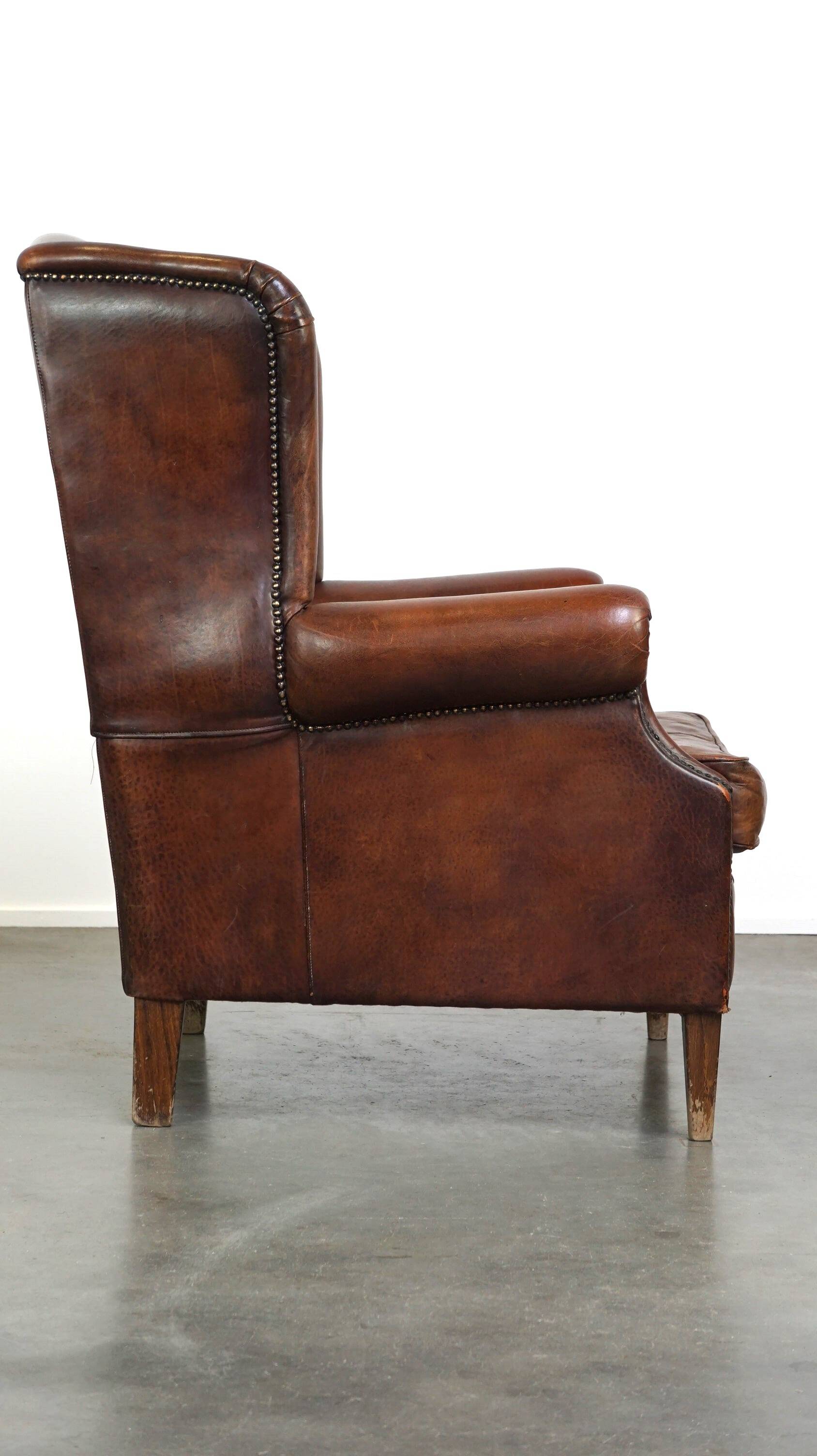Large sheepskin wing chair with excellent colour and great seating comfort