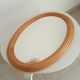 Vintage oval mirror in beech from the 70s/80s.