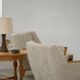 Modern Danish, a pair of easy chairs in oak and lamb's wool, Henning Kjærnulf, 1960s.