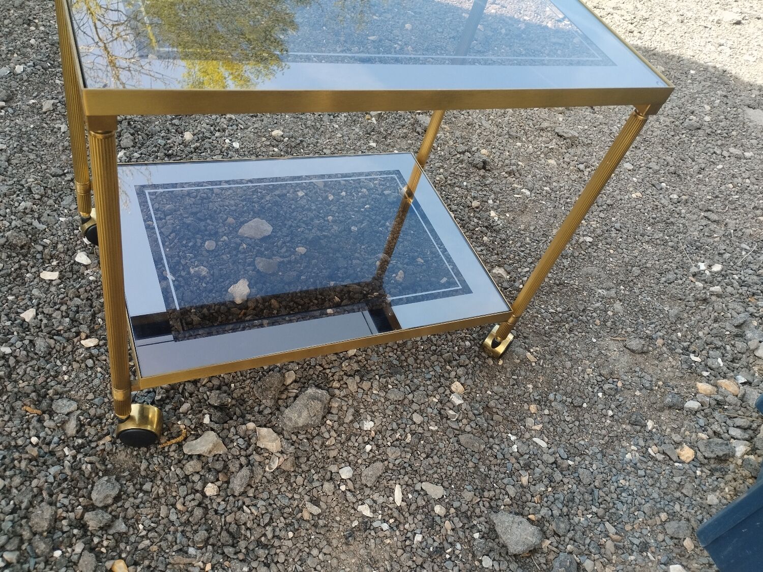 Vintage golden metal rolling dessert trolley