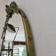 Oval mirror in gilded brass with frieze 40s 50s, 37x50 cm