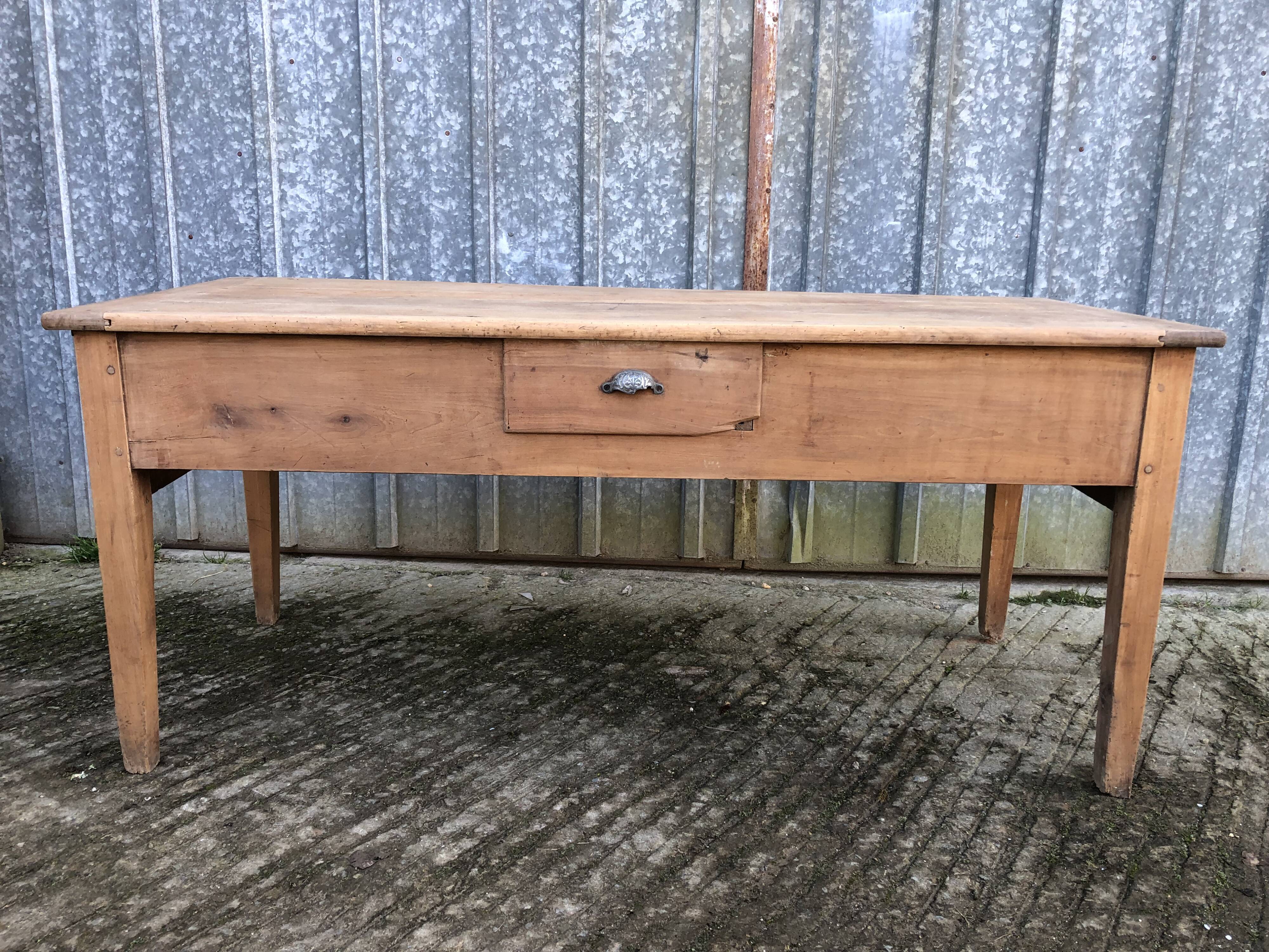 Antique solid cherry farmhouse table with 3 drawers and 1 pull out.