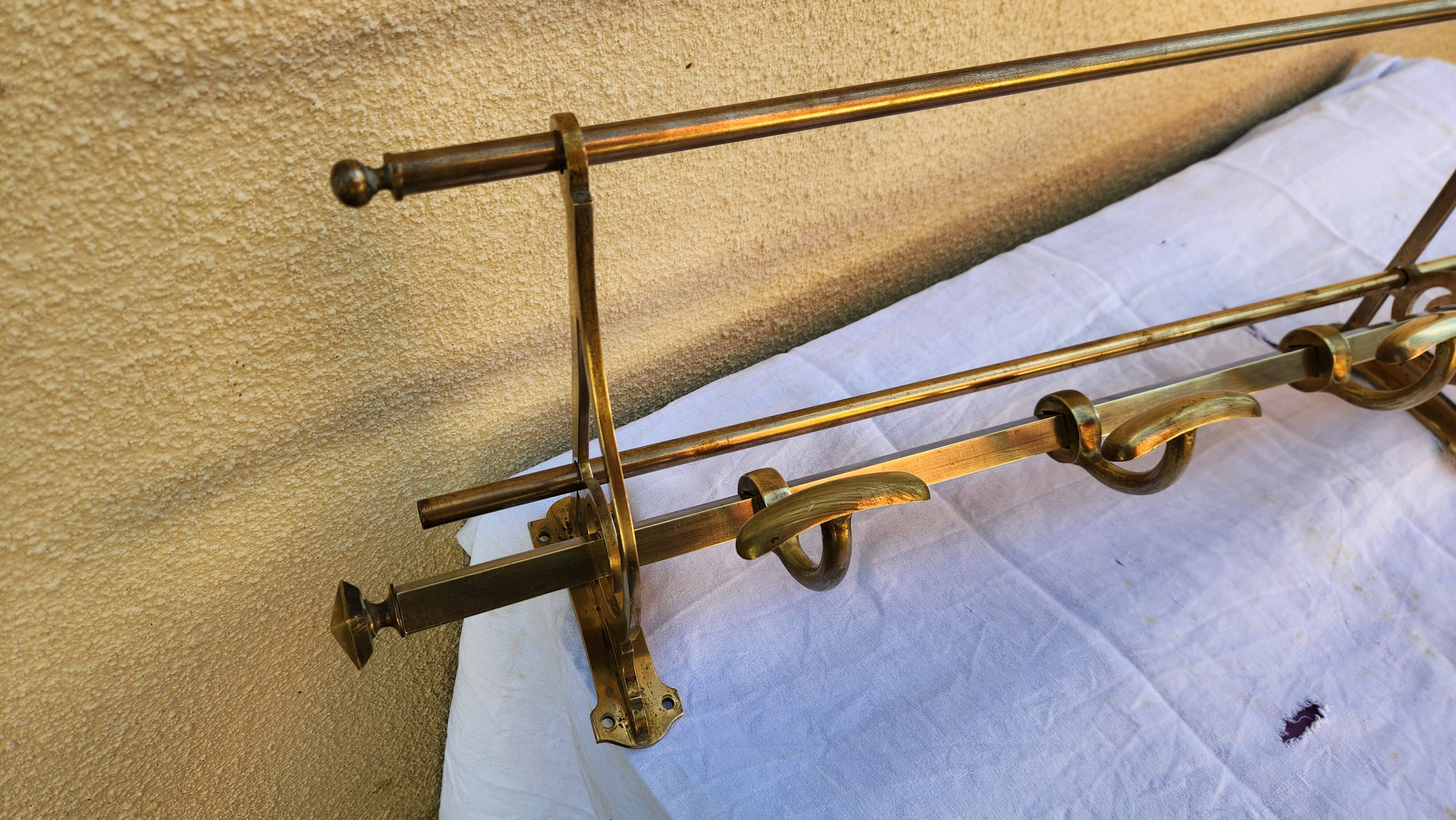 very beautiful wall-mounted coat rack wardrobe in brass from the 19th century