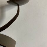 Pair of modernist candlesticks in beaten iron 1970