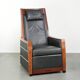 Electrically adjustable Art Deco design recliner with black cowhide leather