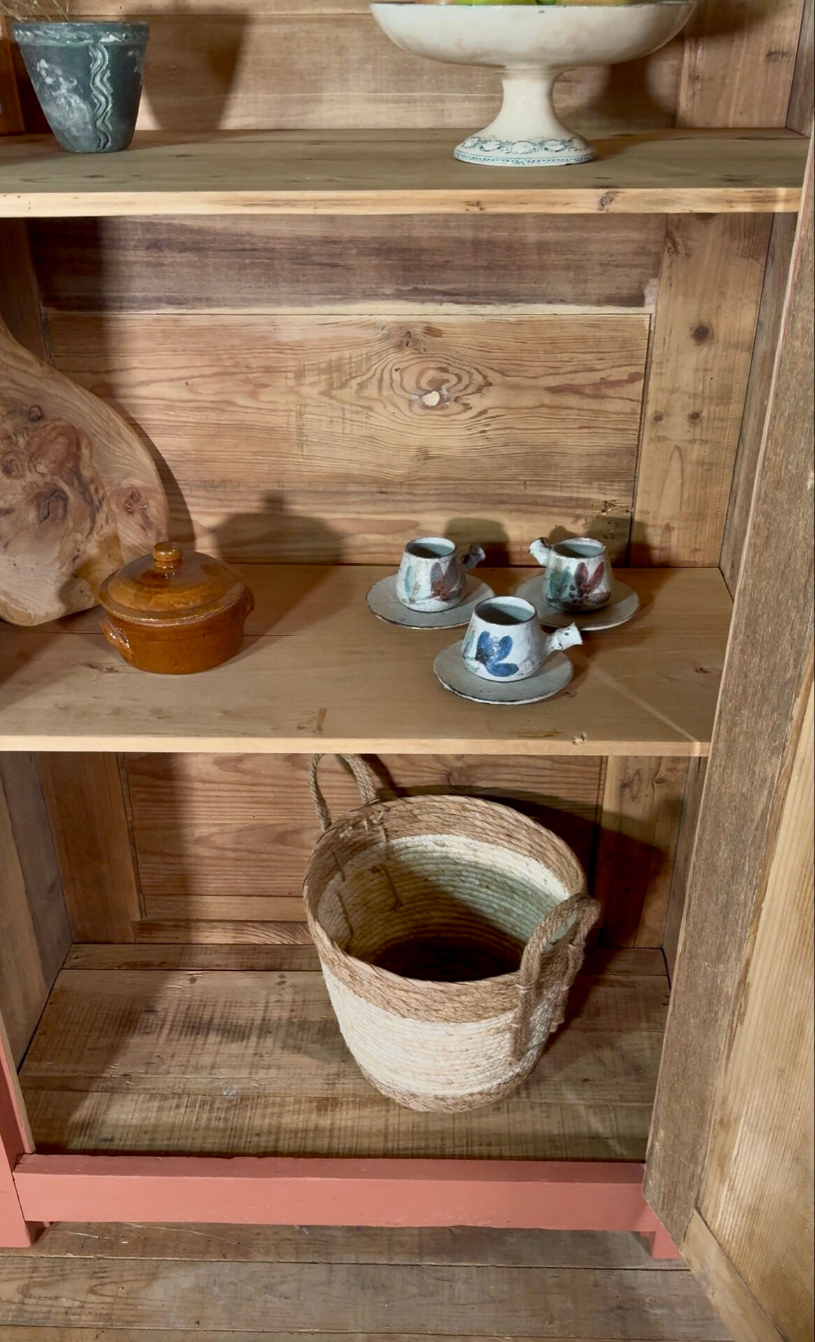Antique glass-fronted terracotta cupboard